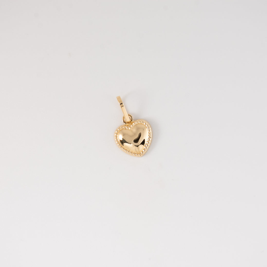 Dije Corazon Liso Oro Amarillo 18k / NA102 / M: 1.5 cms x 1 cm / P: 0.6 gr