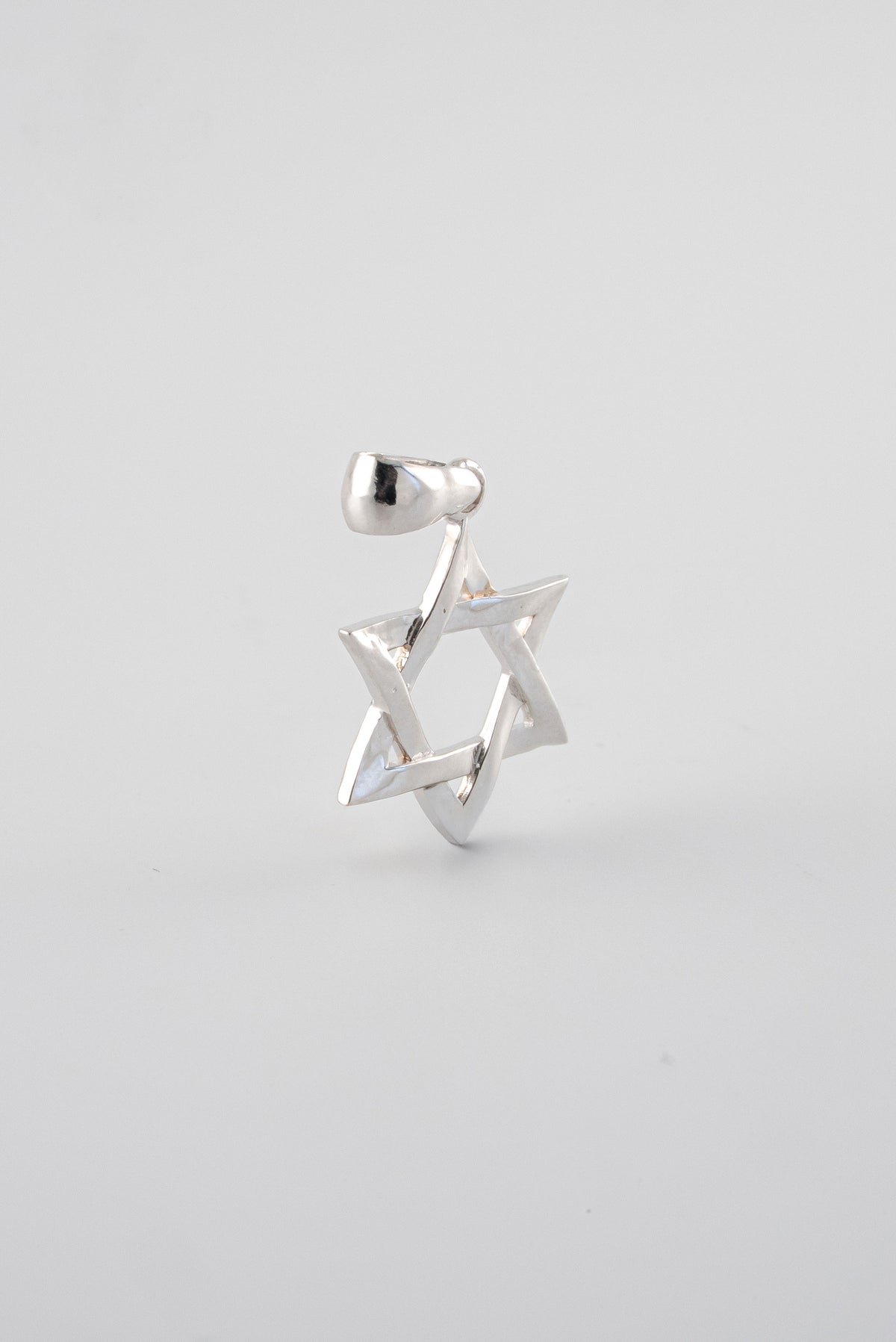 Dije Estrella David Lisa Oro Blanco 18k / NA102 / M: 2 cms x 1,2 cms / P: 1,3 gr
