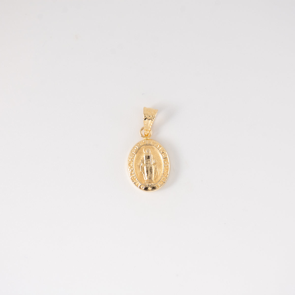 Dije Virgen Milagrosa Oro Amarillo 18k / NA102 / M: 1.8 cms x 1.2 cms / P: 0.6 gr