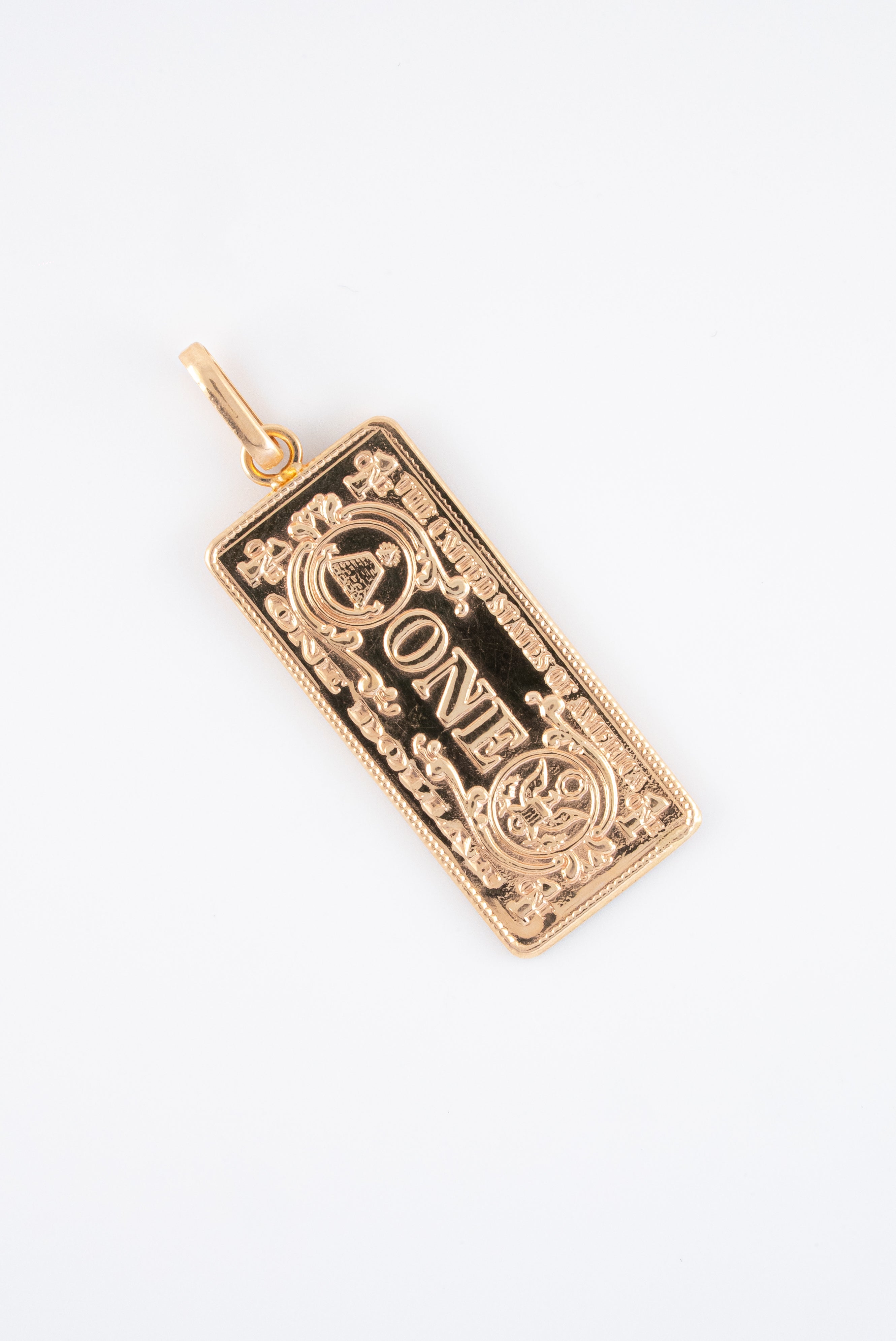 Dije Dolar Liso Oro Rosado 18k / NA102 / M: 4 cms x 1.5 cms / P: 5 gr