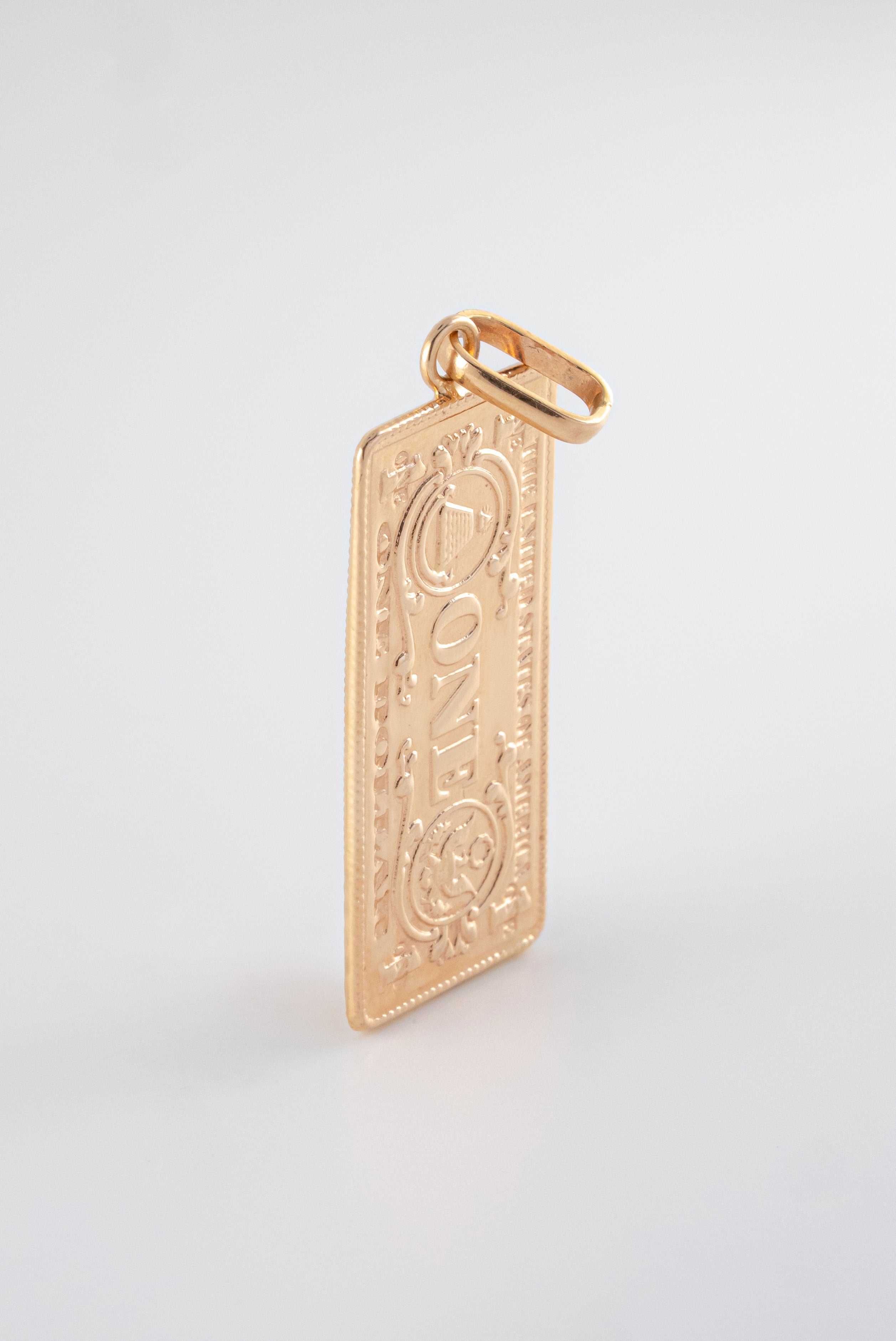 Dije Dolar Liso Oro Rosado 18k / NA102 / M: 4 cms x 1.5 cms / P: 5 gr