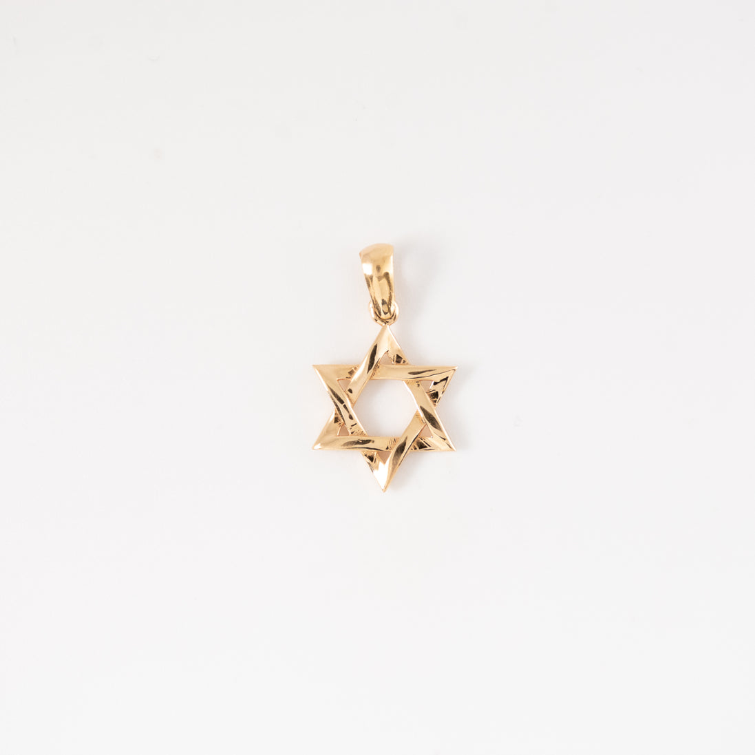 Dije Estrella David Liso Oro Rosado 18k / NA102 / M: 2 cms x 1,3 cms / P: 1.2 gr