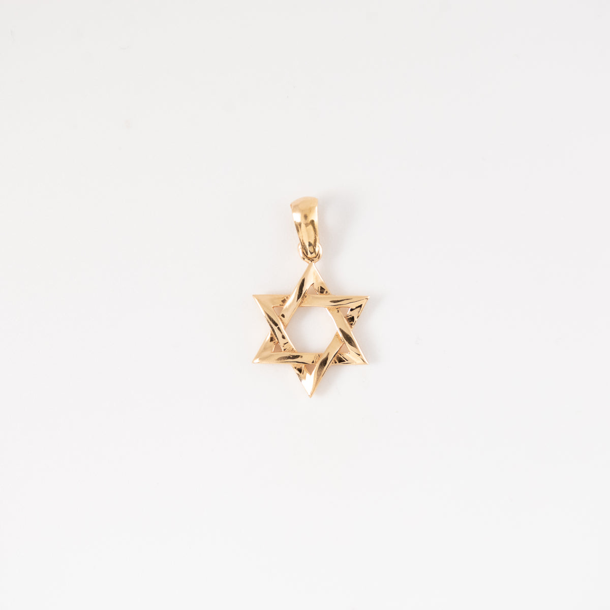 Dije Estrella David Liso Oro Rosado 18k / NA102 / M: 2 cms x 1,3 cms / P: 1.2 gr